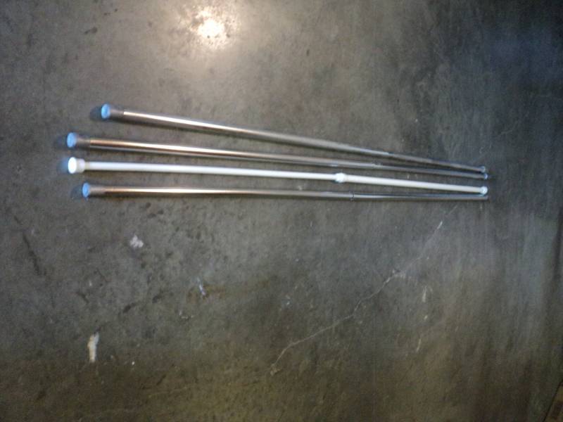 lot 9742 image: (4) mixed lot spring rods, approx 48 adjustable, used