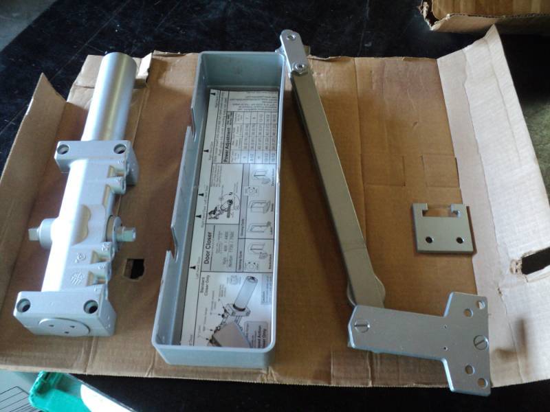 lot 9757 image: Norton Door Closer hardware, may be incomplete
