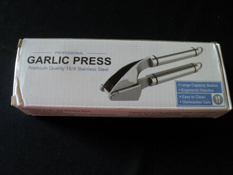 lot 9867 image: (1) Stainless Steel Garlic Press