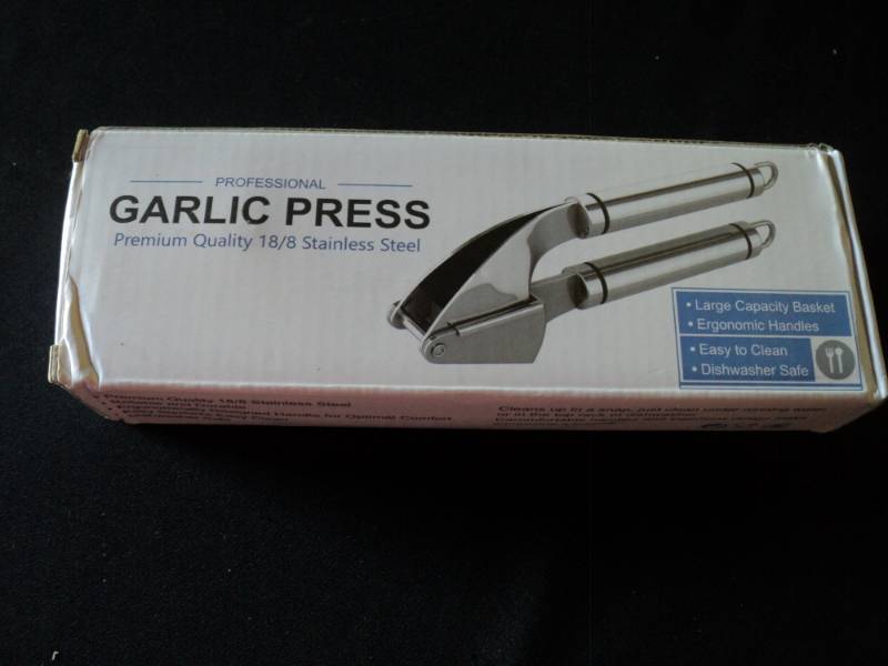 lot 9868 image: (1) Stainless Steel Garlic Press
