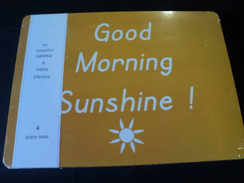lot 9871 image: (1) package of (4) Breakfast Placemats, 16 x 11, cork backed Good Morning Sunshine