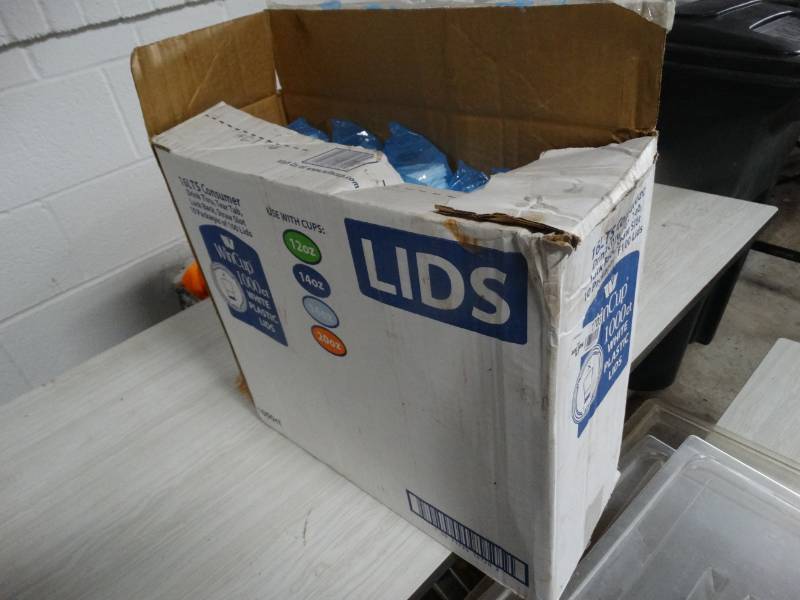 lot 1703 image: Case of plastic lids