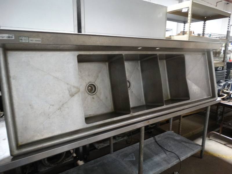 lot 1778 image: Sanisafe 3 hole stainless steel sink- 7 ft long- drain board on each side