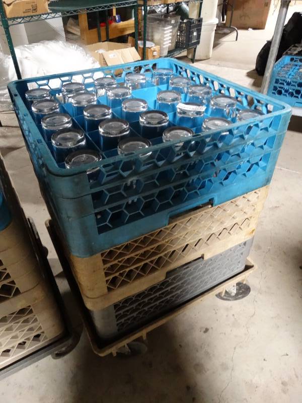 lot 1889 image: 74 drink glasses w 3 dish racks & dish rack cart