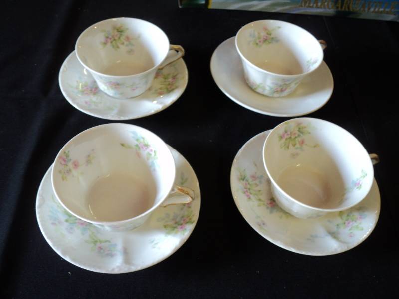 lot 9964 image: (8) pieces mixed lot Theodore Haviland Cups(4) and saucers (3) and  (1) Iron stone saucer