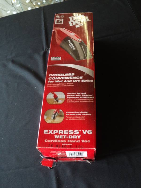 lot 10000 image: Dirt Devil Express V6 Cordless Wet Dry Hand Vac, Powers on, will need to be charged