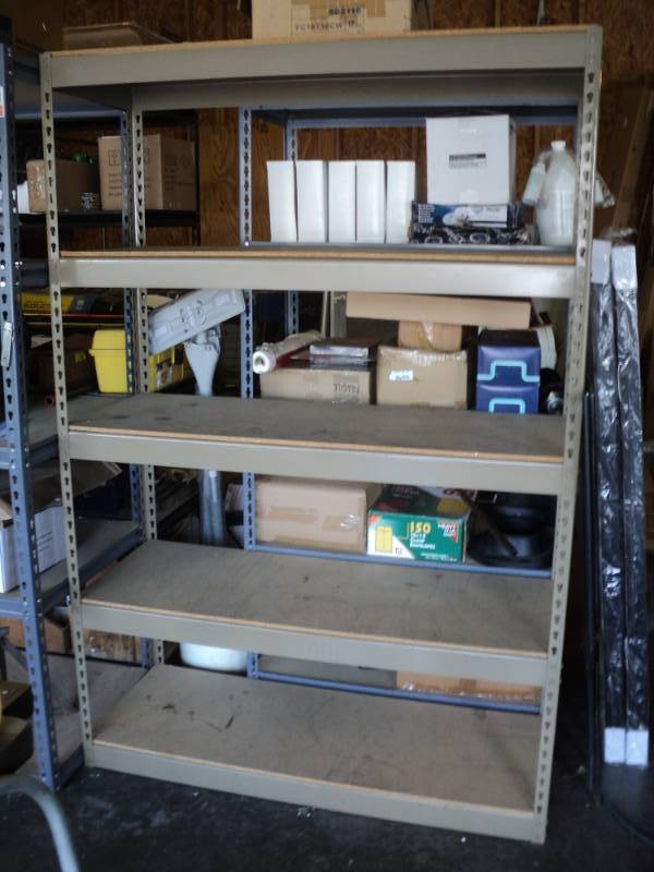 lot 10101 image: 5- Tier shelf, 48 x 18 x 6 tall, Tan, includes (10) 48 braces, (10) 18 braces, (8) 36 corners and (5) 48 X 18 Composite Wood boards