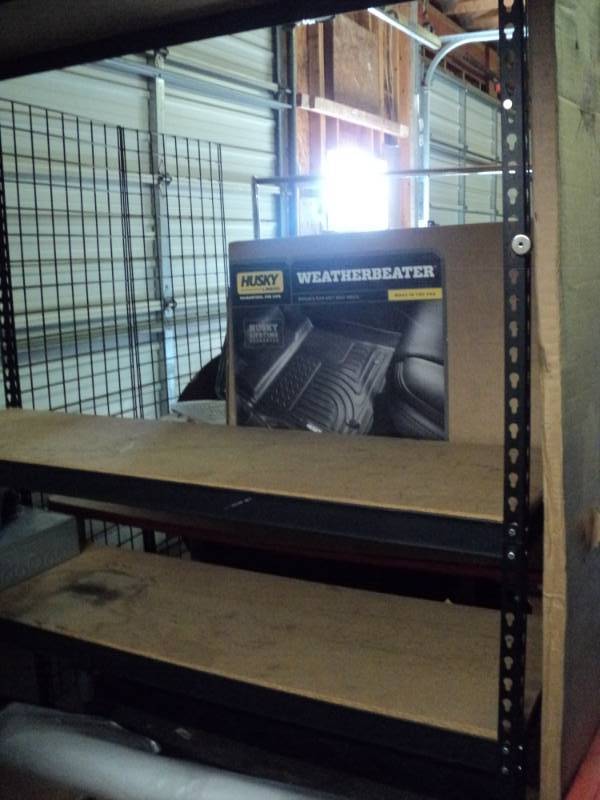 lot 10076 image: Hardware for 4- tier shelf, Black 5 x 18 x 78 tall, includes (8) 64 braces, (8) 18 braces, (8) 39 corners, (3) shelf boards included