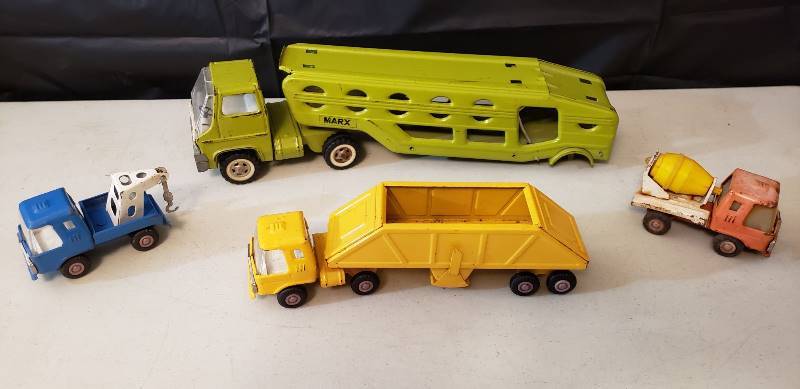 lot 1316 image: Lot of Vintage Metal Trucks Made in Japan - set of 4