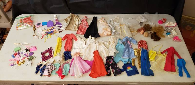 lot 1334 image: Lot of Vintage Barbie Clothing and Accessories