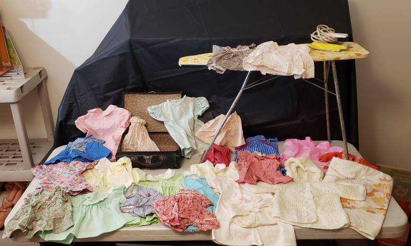 lot 1340 image: Lot of Vintage Baby Doll Clothing, Small Suitcase, Ironing Board and Iron