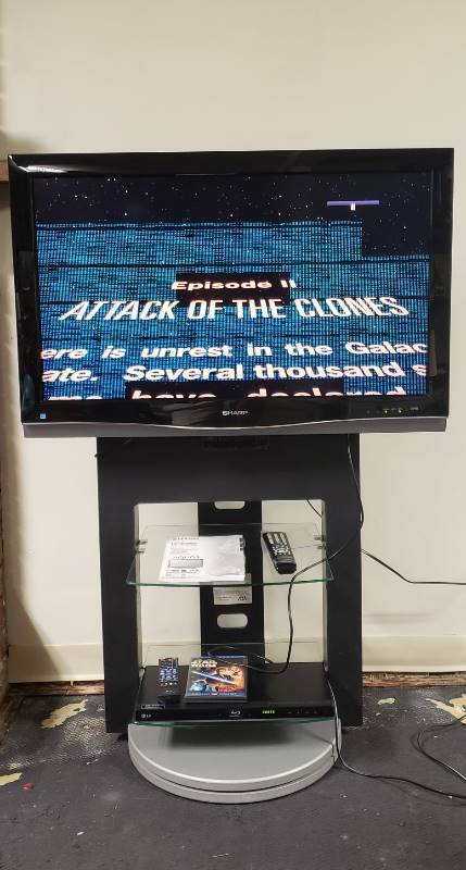 lot 1359 image: Sharp Aquos 37  Flatscreen TV with Remote and Swivel Base Media Stand - LG Blueray Player NOT included - Screen Issue See Pictures