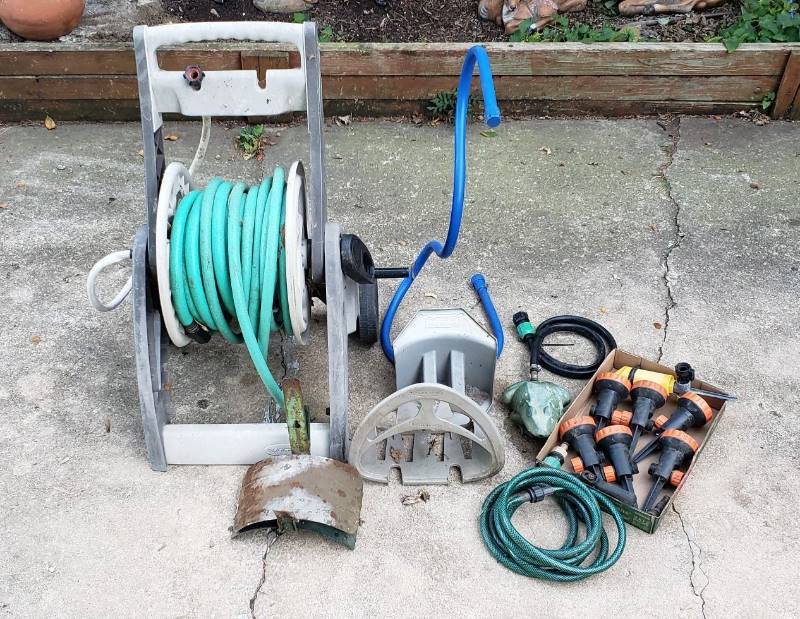 lot 1422 image: Lot of Watering Hose, Holders, and Sprinklers