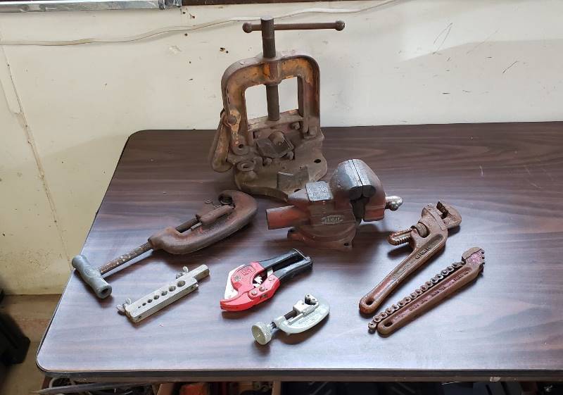lot 1492 image: Lot of Pipe Working Tools - Ridgid Pipe Vise, Dunlap Vise, Ridge Tool Pipe Cutter, and Other Cutters and Wrenches