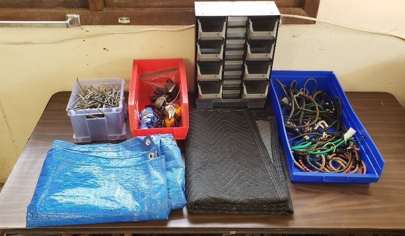lot 1496 image: Lot of Organizers, Ratchet Straps, Peg Board Hooks, Bungee Cords, and TrapBlanket