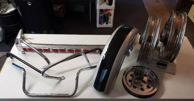 lot 1512 image: Harley Motorcycle Parts - Wheel Rims, Belt Driver, Handle Bar, And Other Parts