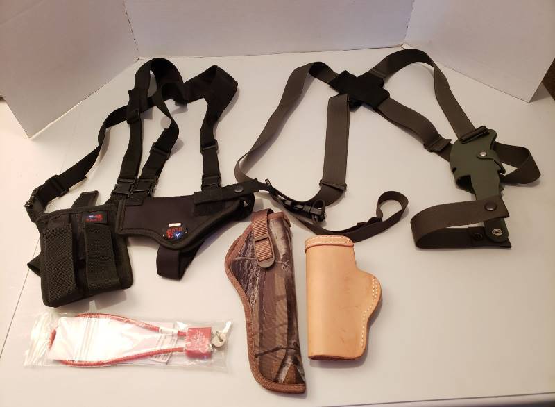lot 1550 image: Lot of Pistol Holsters and Gun Lock