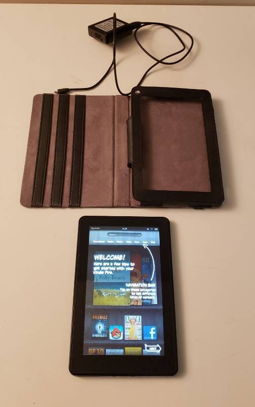 lot 1634 image: Amazon Kindle model d01400 with case and adapter - works