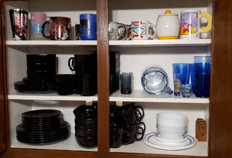 lot 1708 image: Contents of Upper Kitchen Cabinet - 3 sets of Dishes, Sets of Glasses & Pitcher, and Coffee CupsMugs
