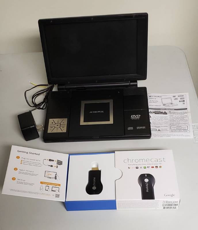 lot 1730 image: Chromecast by Google and Audiovox Portable DVD Player - Powers On