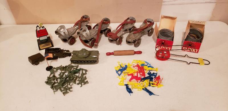 lot 3069 image: Lot of Vintage Toys - 2 pair of Steel Wheel Skates, 2 Metal Slinkys wboxes, Whee-Lo, Plastic CowboysIndians and Army Men
