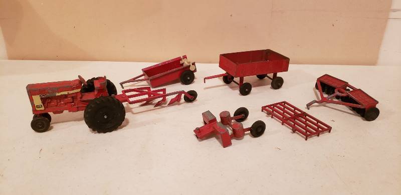 lot 3072 image: Vintage Ertl McCormick Farmall 656 Tractor with 6 Implement Attachments