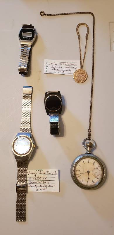 lot 3133 image: Lot of 4 Mens Watches (Elgin Pocket watch, Texas Instrument LED, Q Timex Quartz, and Quartz III) and Rambler Advertisement Lucky Horseshoe
