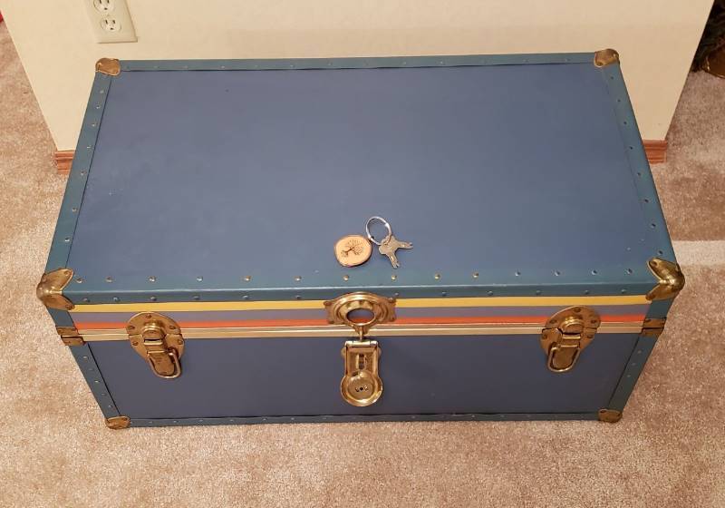 lot 3204 image: Vintage Blue Footlocker (31  x 17  x 14 ) full of Vintage Baby Clothing & Accessories (boys & girls)