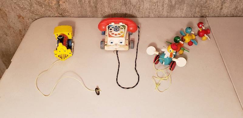 lot 3237 image: Vintage Fisher Price Toys with Wood Wheels (3)