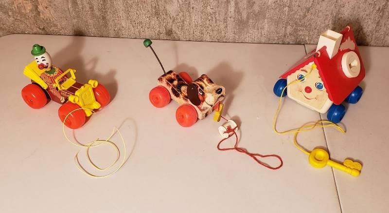 lot 3238 image: Lot of Fisher Price Toys with Plastic Wheels