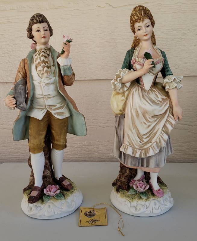 lot 3309 image: Lefton China Victorian Couple Figurines - Male has a chipped Leaf on the Flower in Hand