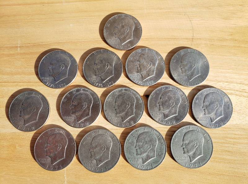 lot 3317 image: Lot of 14 IKE Dollar - (4) 1971, (5) 1972, (4) 1976, and a 1977