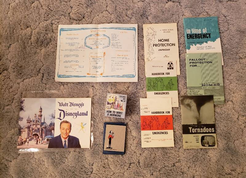 lot 3335 image: 1958 Walt Disney Disneyland Guide, 1980 Olive Oyl Mirror, Science Kit Joke Box and Signed Menu