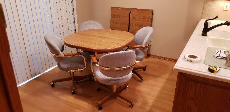 lot 3024 image: Wood Top Dining Table  Metal Leg Base with 4 Matching Slate Blue Chairs on Casters and (2) 18  leaves - Table wo leaves 40  x 40  x 30