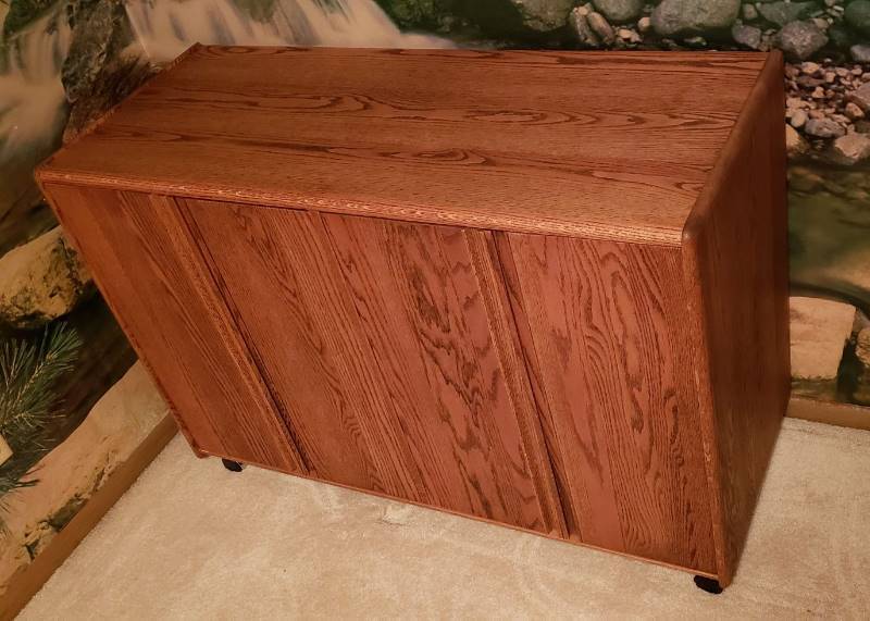lot 2205 image: Custom Woodwork & Design Solid Wood 4 door Cabinet on Casters - 48 in. x 19 in. x 31 12 in.