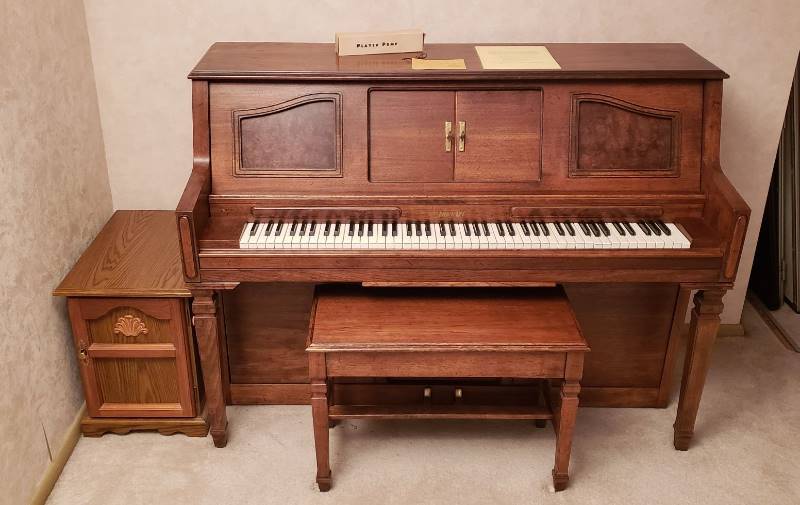 lot 2220 image: DuoArt Player Piano made by Aeolian Corp. - includes Bench, Cabinet (holding rolls) and 42 player piano rolls