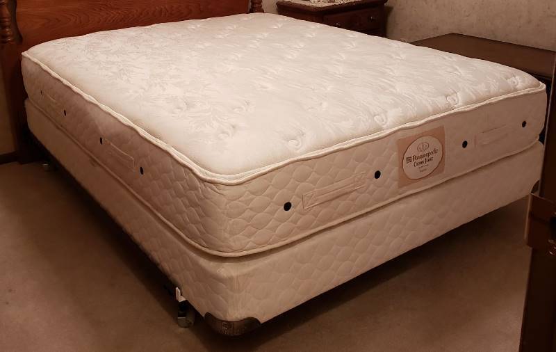 lot 2232 image: Queen Size Posturepedic Crown Jewel Mattress, Box Springs, and Hollywood Metal Frame - Headboard and other items not Included