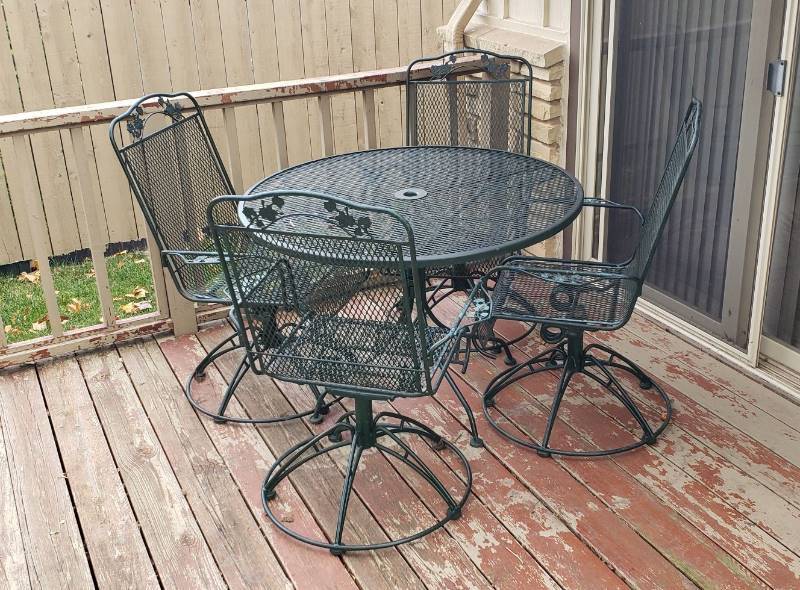 lot 2242 image: Dark Green Metal Open Mesh 42 in. Patio Table with 4 Spring Rocking Chairs