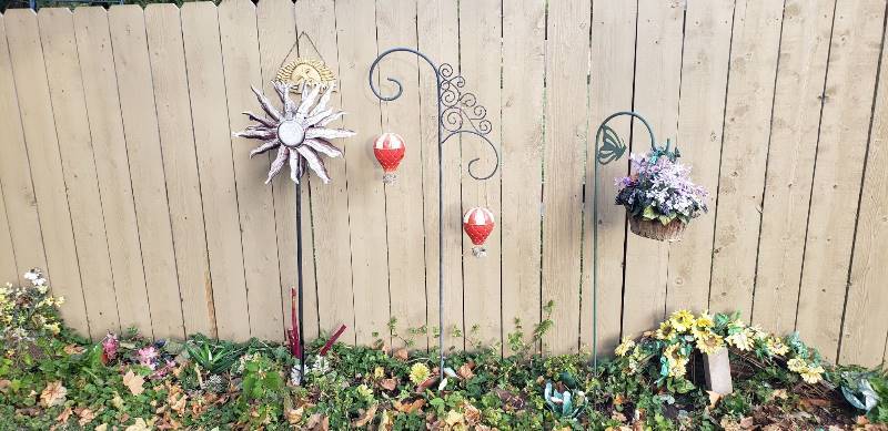 lot 2244 image: Lot of Outdoor Decor - 2 Sheperd hooks, 1 Whirling, and Welcome hanger - tallest one 70 in.
