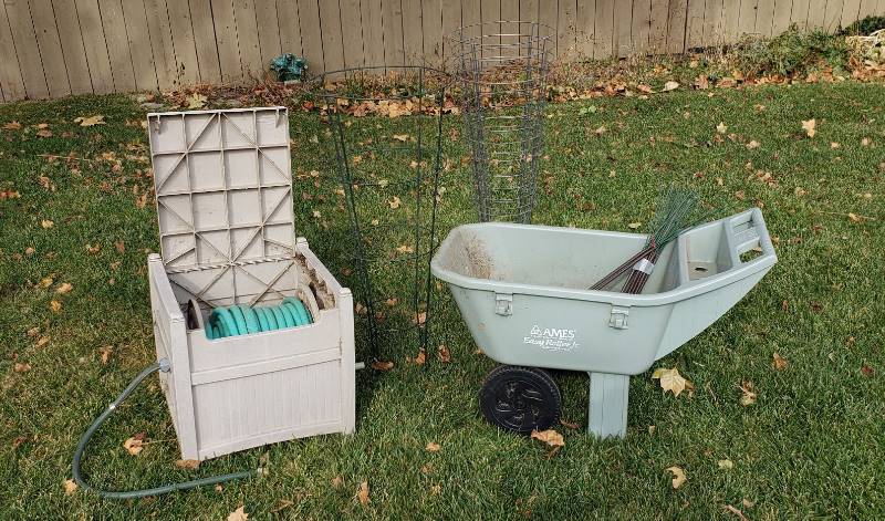 lot 2254 image: Lot of Gardeners Work Tools - Ames Lawn Cart, Hose Reel with Hose, and Plant Holders
