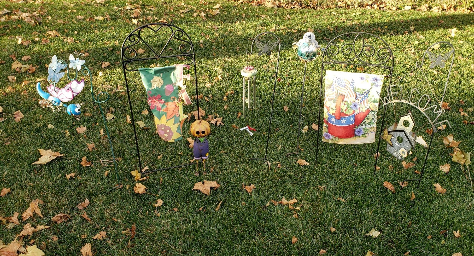 lot 2255 image: Lot of Stick Metal Outdoor Decor with Numerous Flags