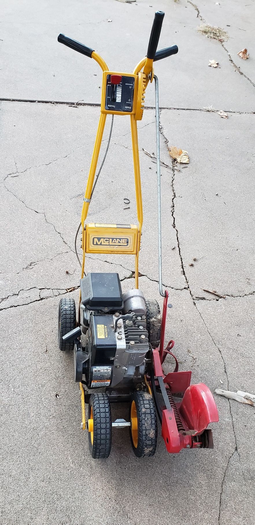 lot 2260 image: McLane 4 Wheel Lawn Steel Blade Edger with 3.5hp Motor
