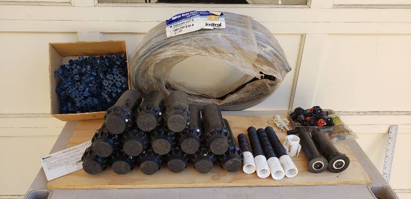 lot 2281 image: Lot of Lawn Irrigation Sprinklers, Hose, and Repair Parts