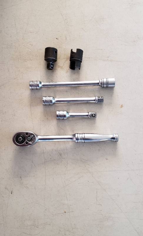 lot 2302 image: Lot of Snap-on 38 in. Ratchet with 3 Extensions, (1) 12 in. socket, GAX 1 Socket Reducer, and S6118 Multi-tool Socket