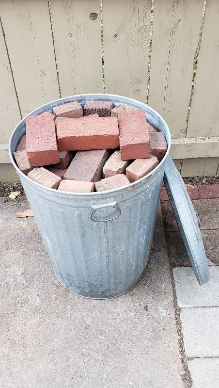 lot 2325 image: 33 Gallon Galvanized Trash Can Full of Used Paver Bricks - too numerous to count