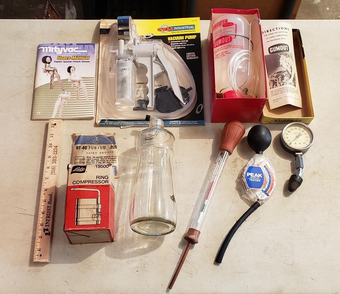 lot 2336 image: Lot of Automotive Testers, Vacuum Pump, Ring Compressor, and Vintage Gumout Gumouter