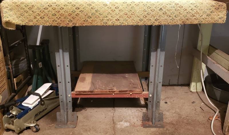 lot 2353 image: Shop Table with Metal Legs - carpet over plywood top - 37 in. x 30 in. x 30 in. - contents on top & jack & jack stands are not included