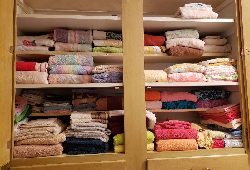 lot 2382 image: Large Lot of Towels in Top of Linen Closet