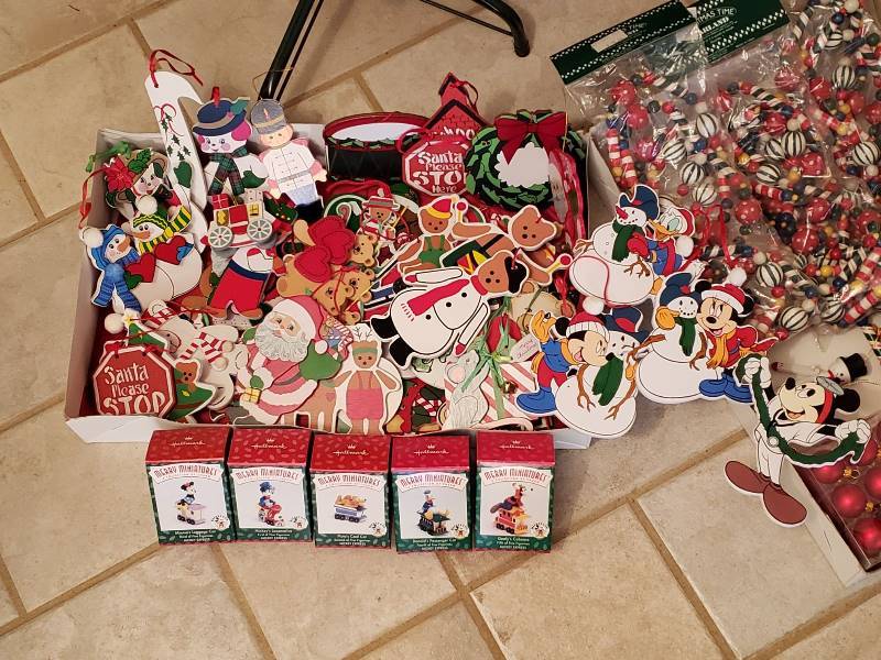 lot 2397 image: Slim 6 ft Tree with Ornaments (Some Disney) and Wood Painted Garland