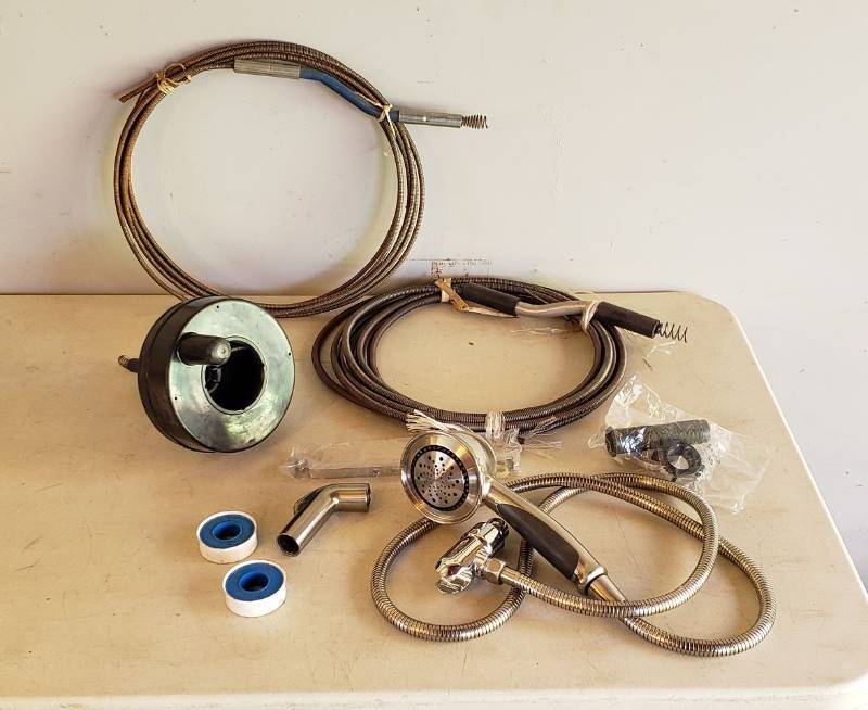 lot 2413 image: Lot of Plumping Items - (3) Drain Snakes, Pipe Thread Tape, Delta Shower Head, and other Items